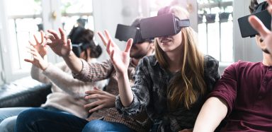 Group of friends with virtual reality headsets on