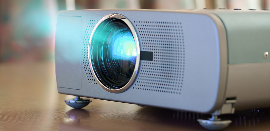 Projector on a table shining light