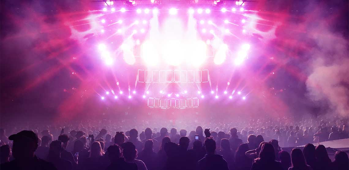 Pink lights at a concert.