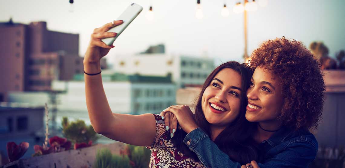 Two women taking a selfie.