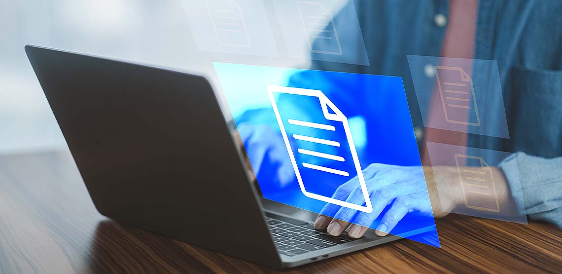 A person typing on a laptop with a holographic blue image of a document floating above.
